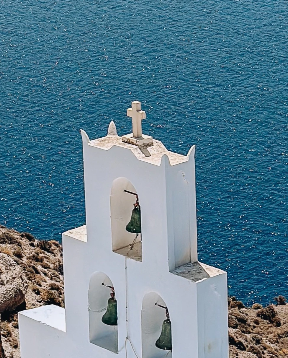 The overlooking view of the bells of Santorini church.