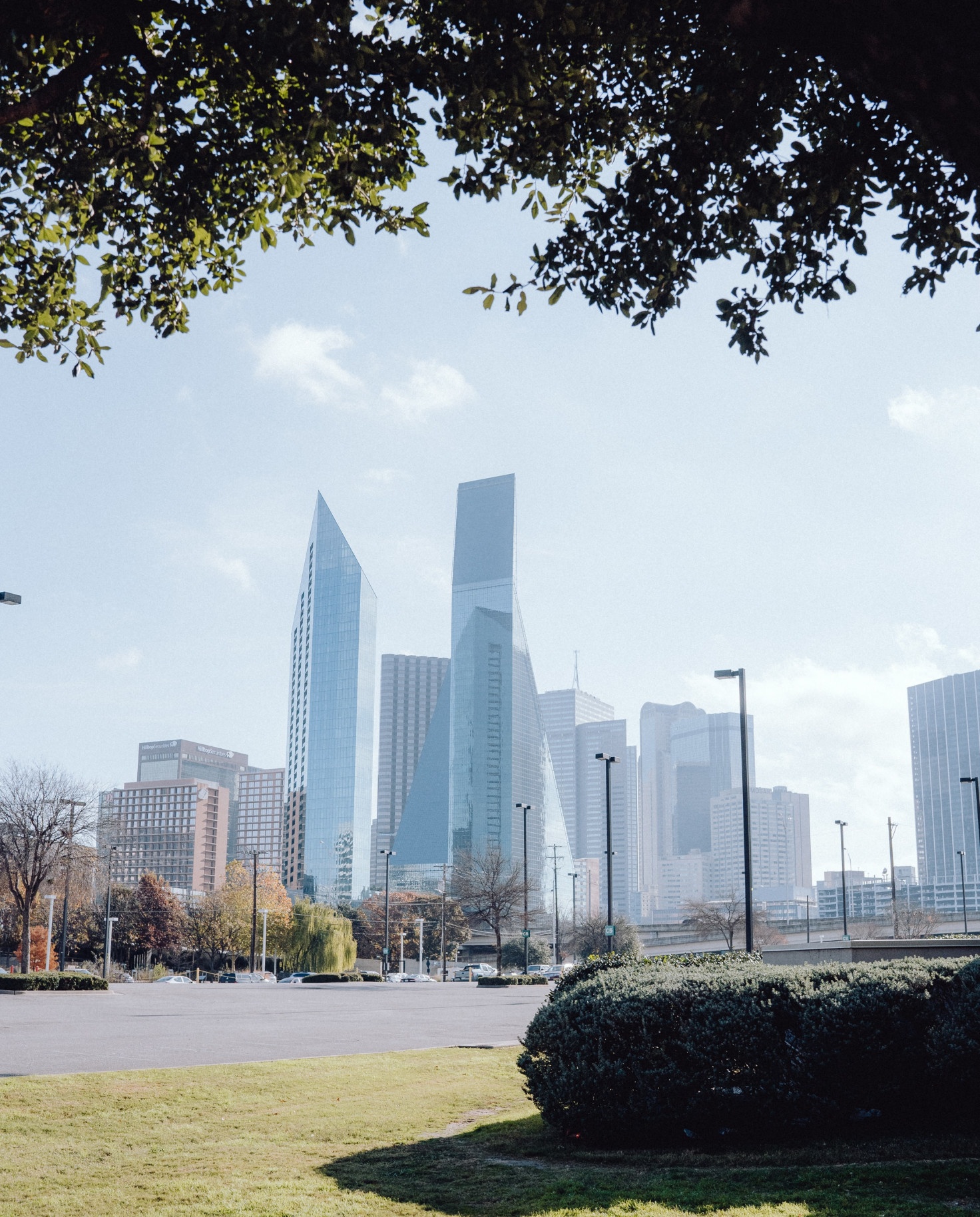 Grass field with buildings during daytime