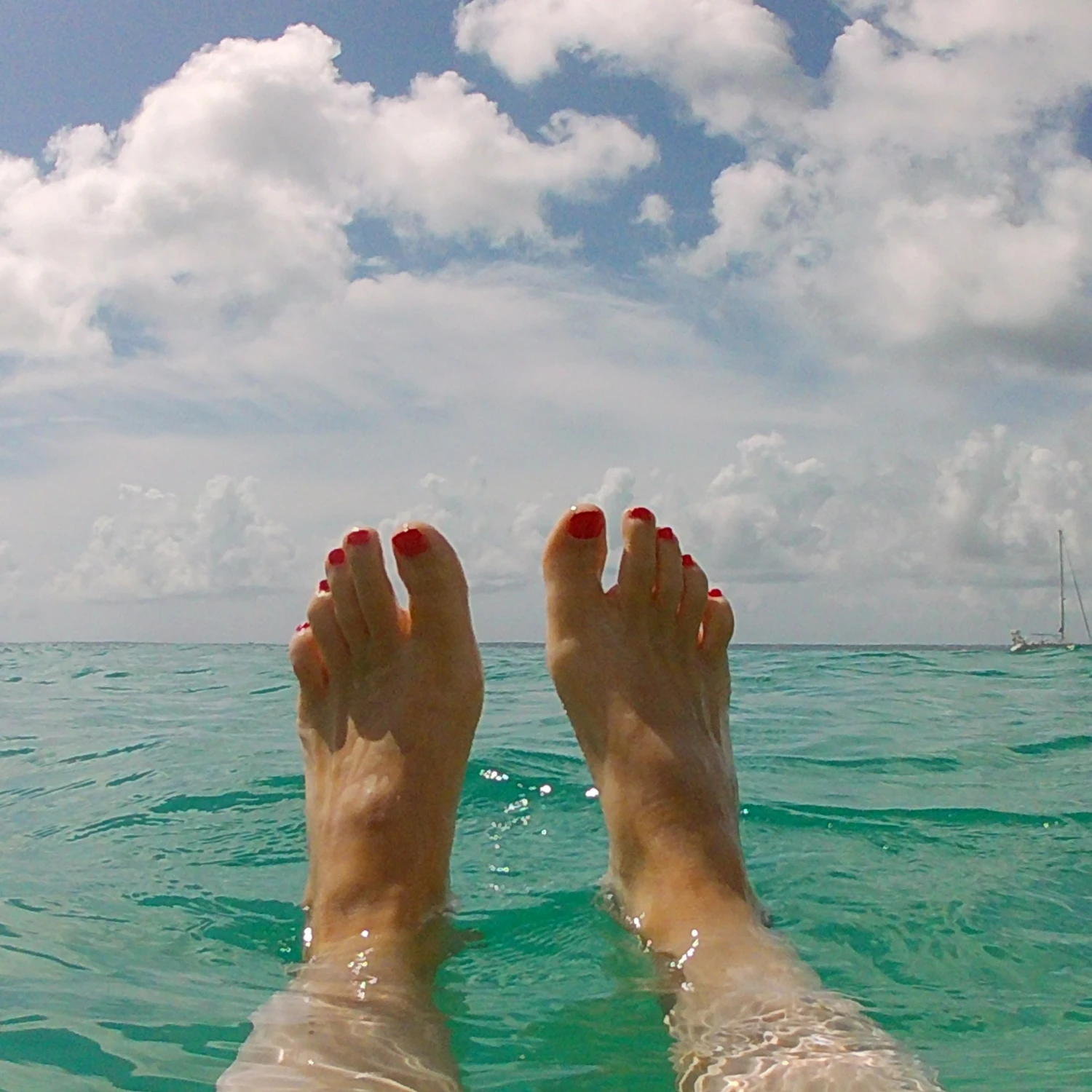 Feet view beside in the sea