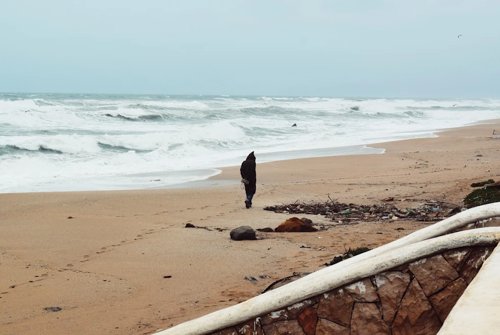 A person walking on the beach