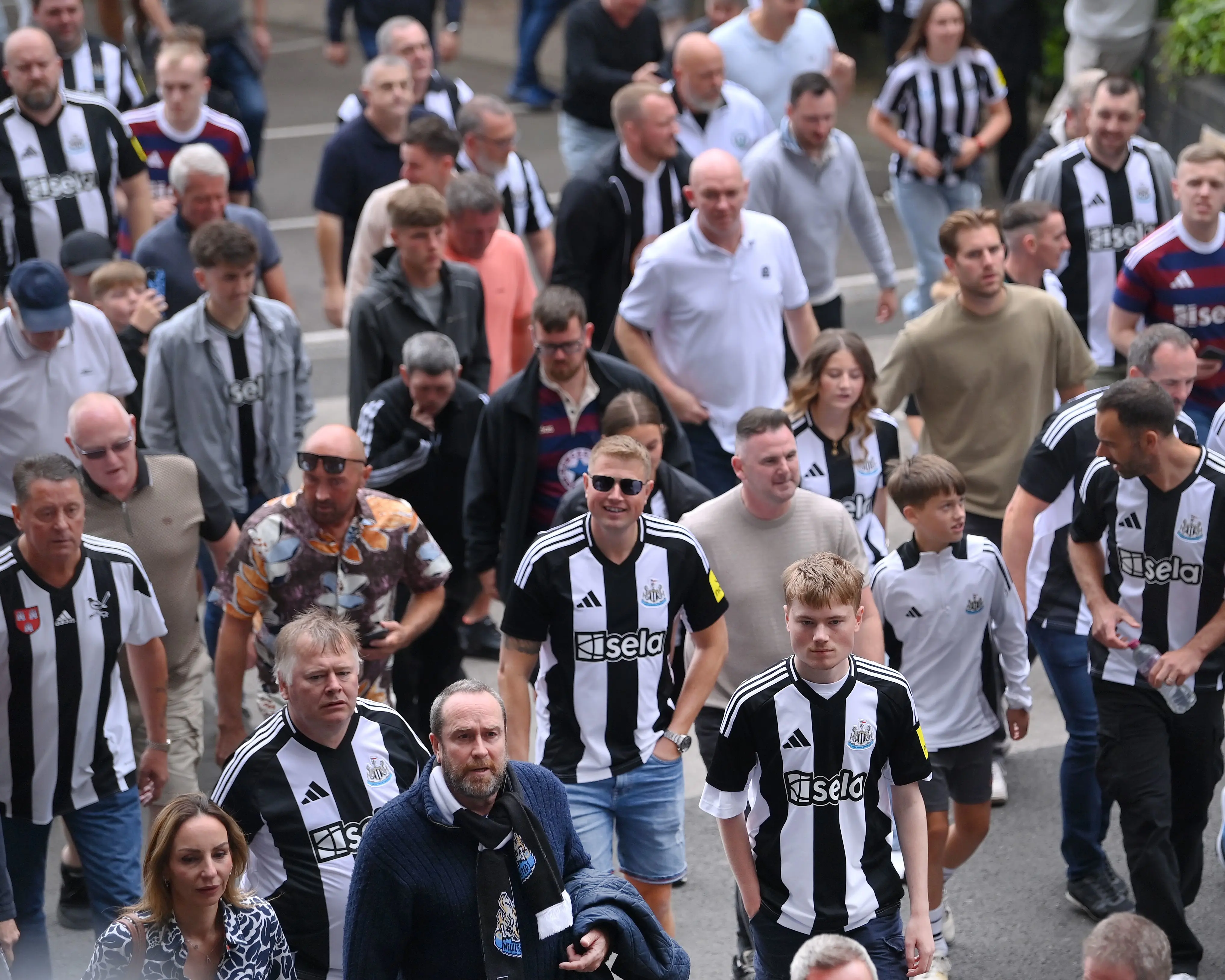 Fans walking stadium