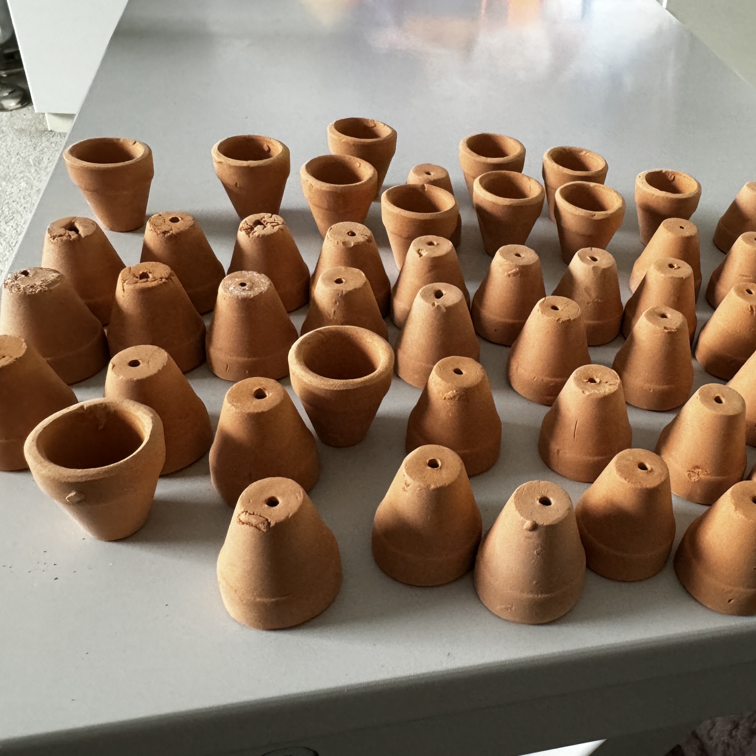 Above: one of the many pics on my phone of my piles of reject pots