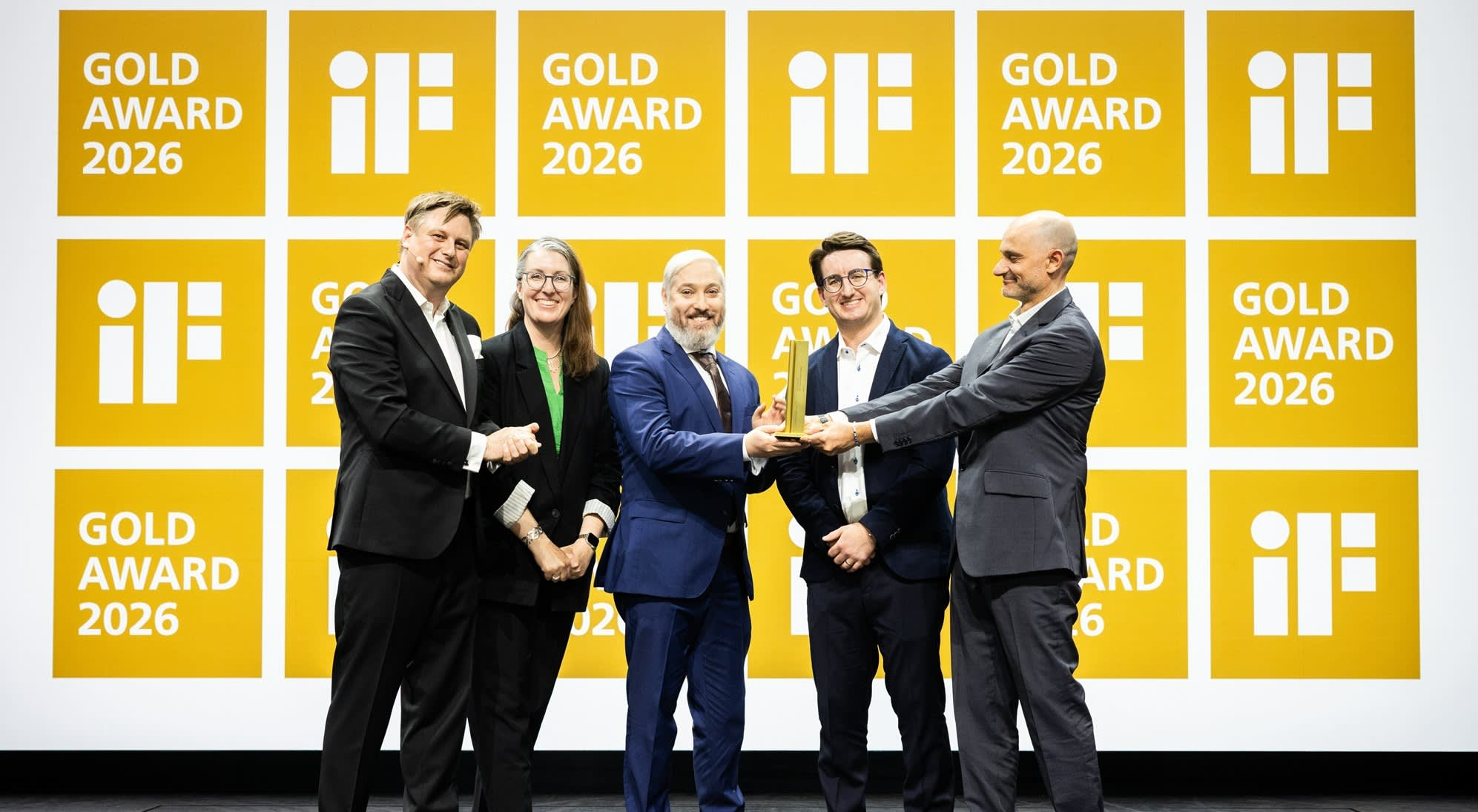 Baxter Schanze, Shawn Deutchman, Flavia Gnecco and Camillo Sassano are celebrating their iF Design Award Gold 2026 on stage at the Award Ceremony in Berlin