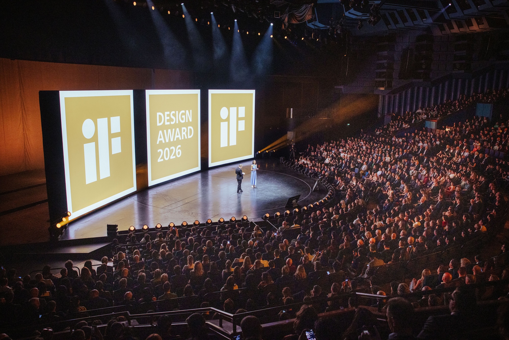 iF DESIGN AWARD Gold Winners celebrate their success with their gold trophy on stage at the iF Design Award Night 2026.