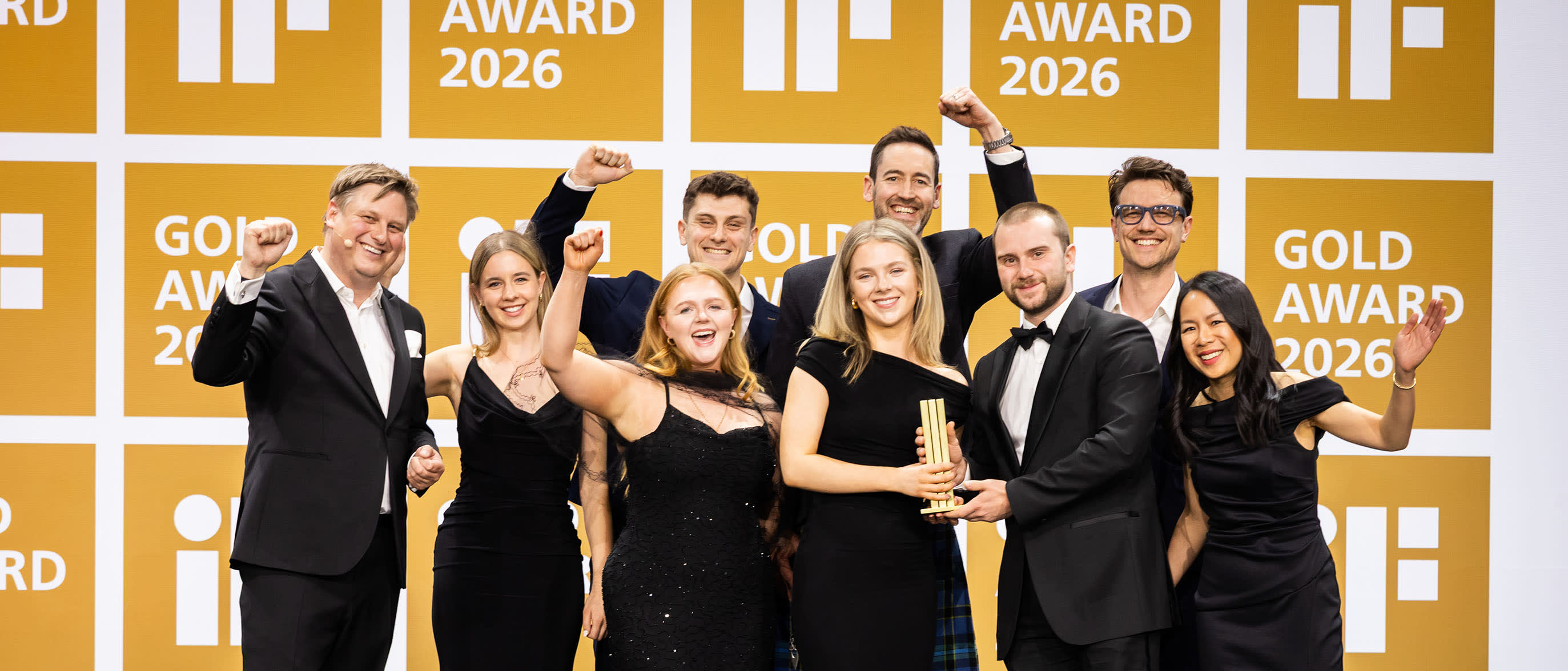 iF Design Award Gold Winners celebrate their success with their gold trophy on stage at the iF Design Award Night 2026
