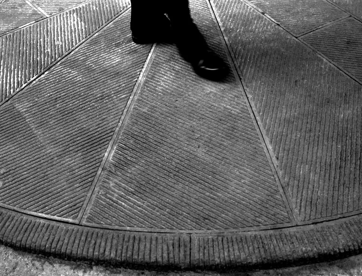 walking feet on pietra serena paving, pietrasanta