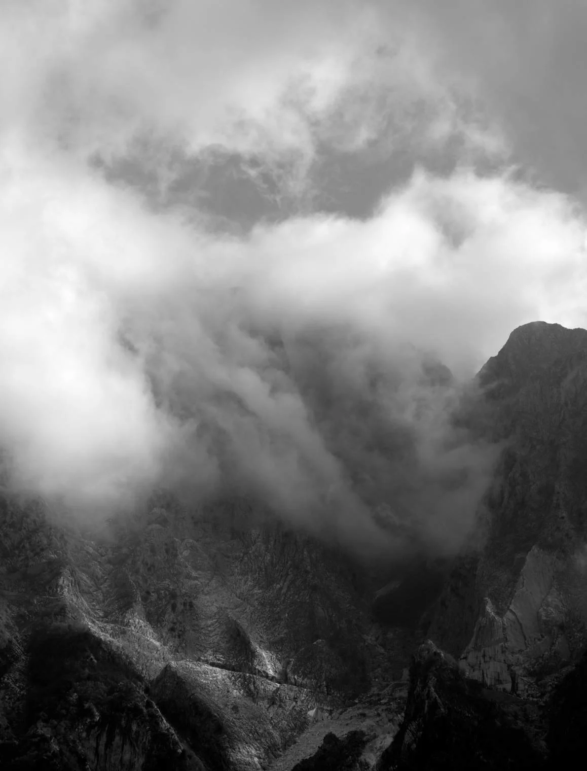 altissimo shrouded in the clouds on the morning of ascent to taca bianca