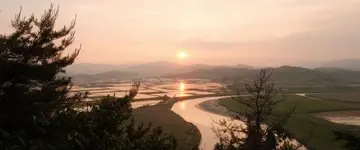 kronkelende-rivier-bij-zonsondergang