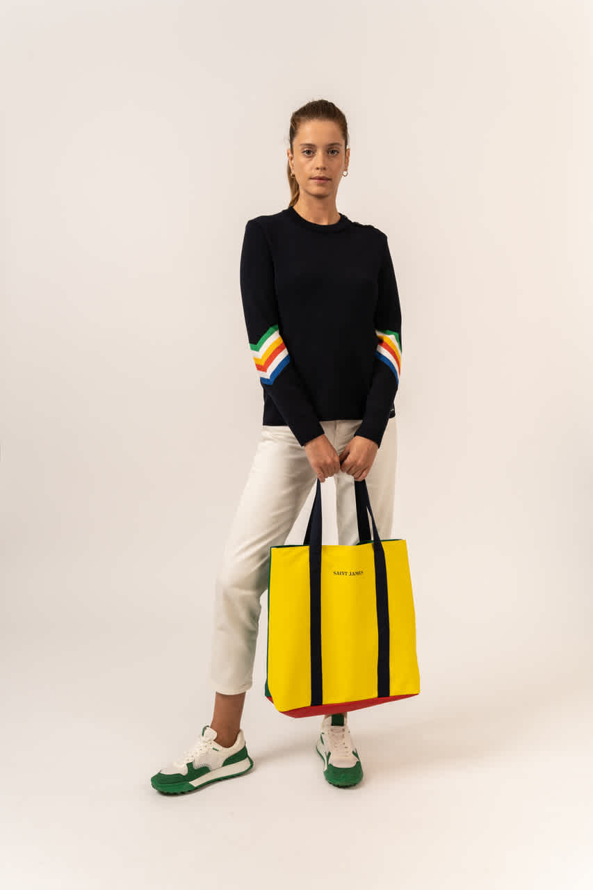 Saint James woman in black jumper and yellow bag