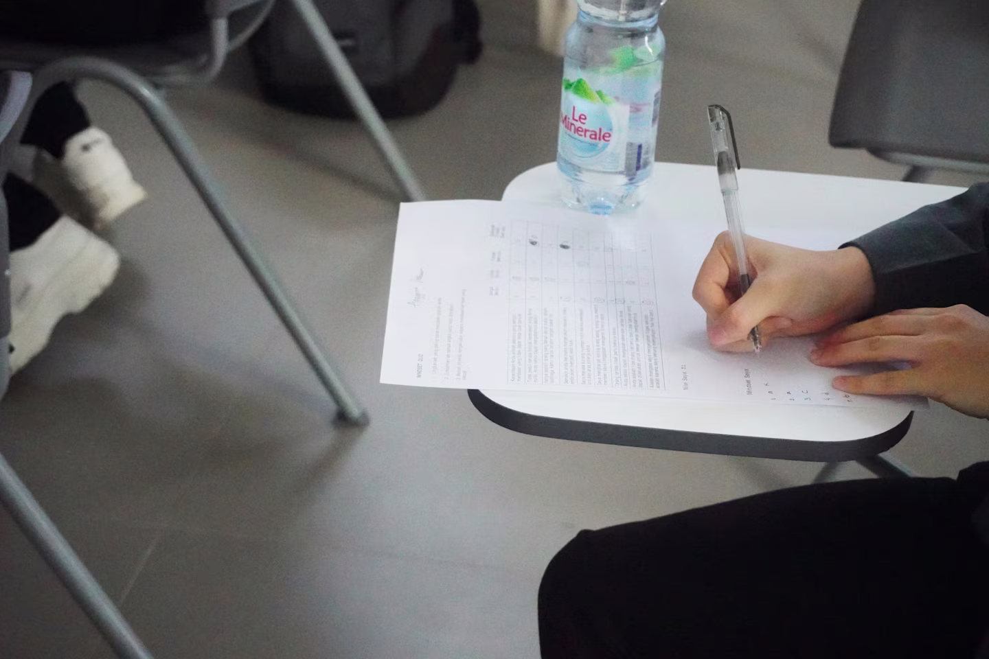 person writting exam