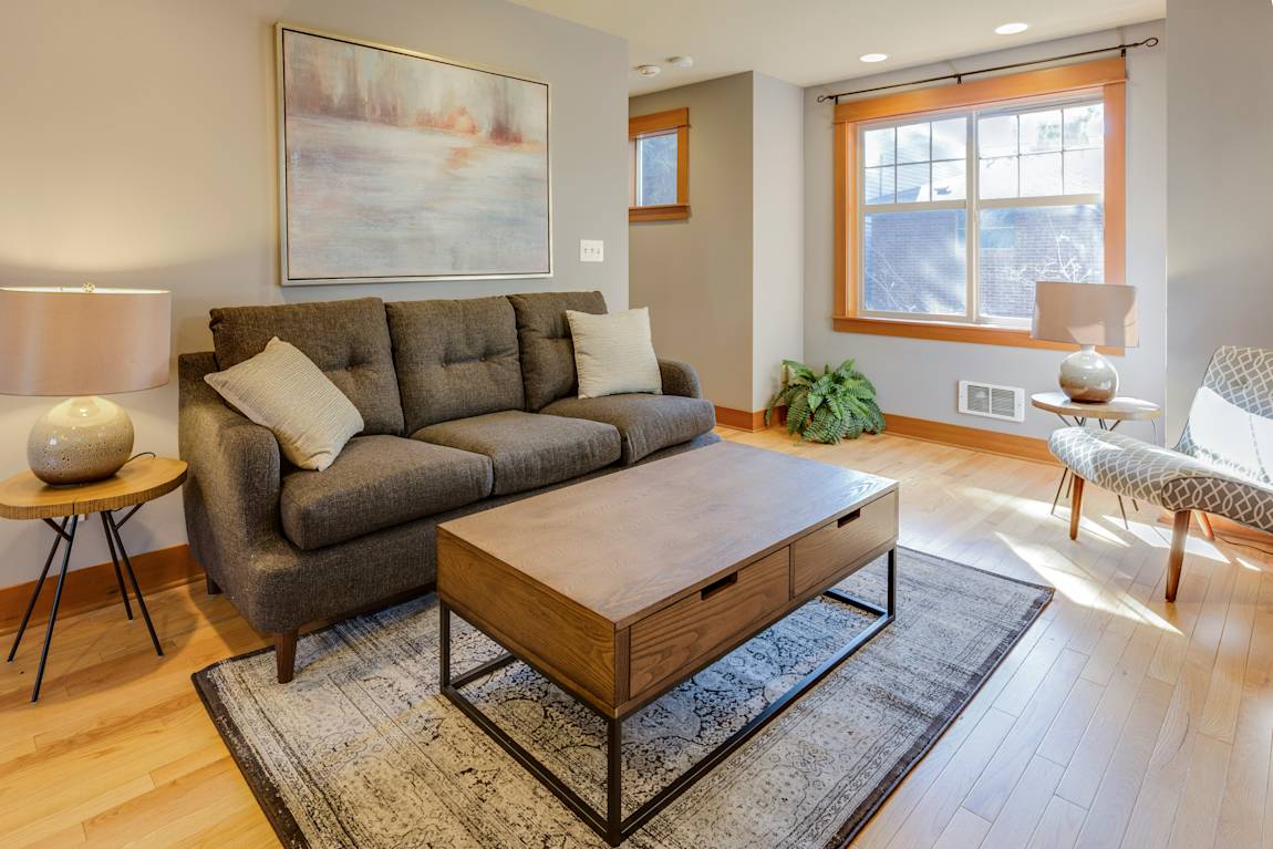 Living room with grey couch and wooden coffee table