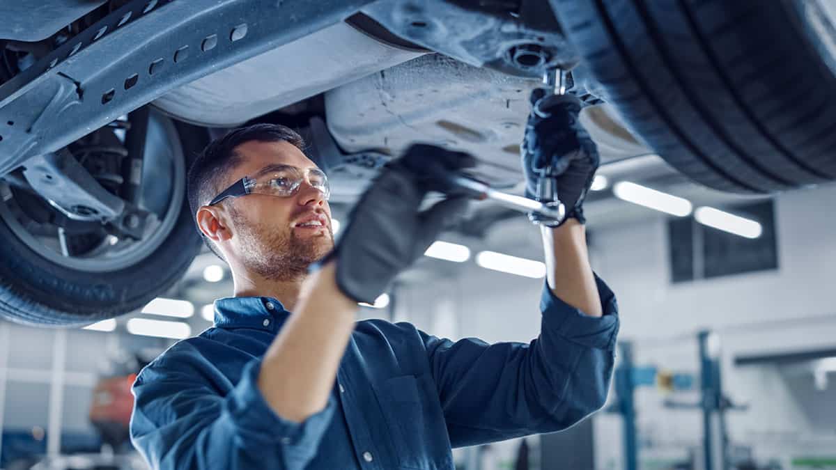 Man wearing automotive uniform.