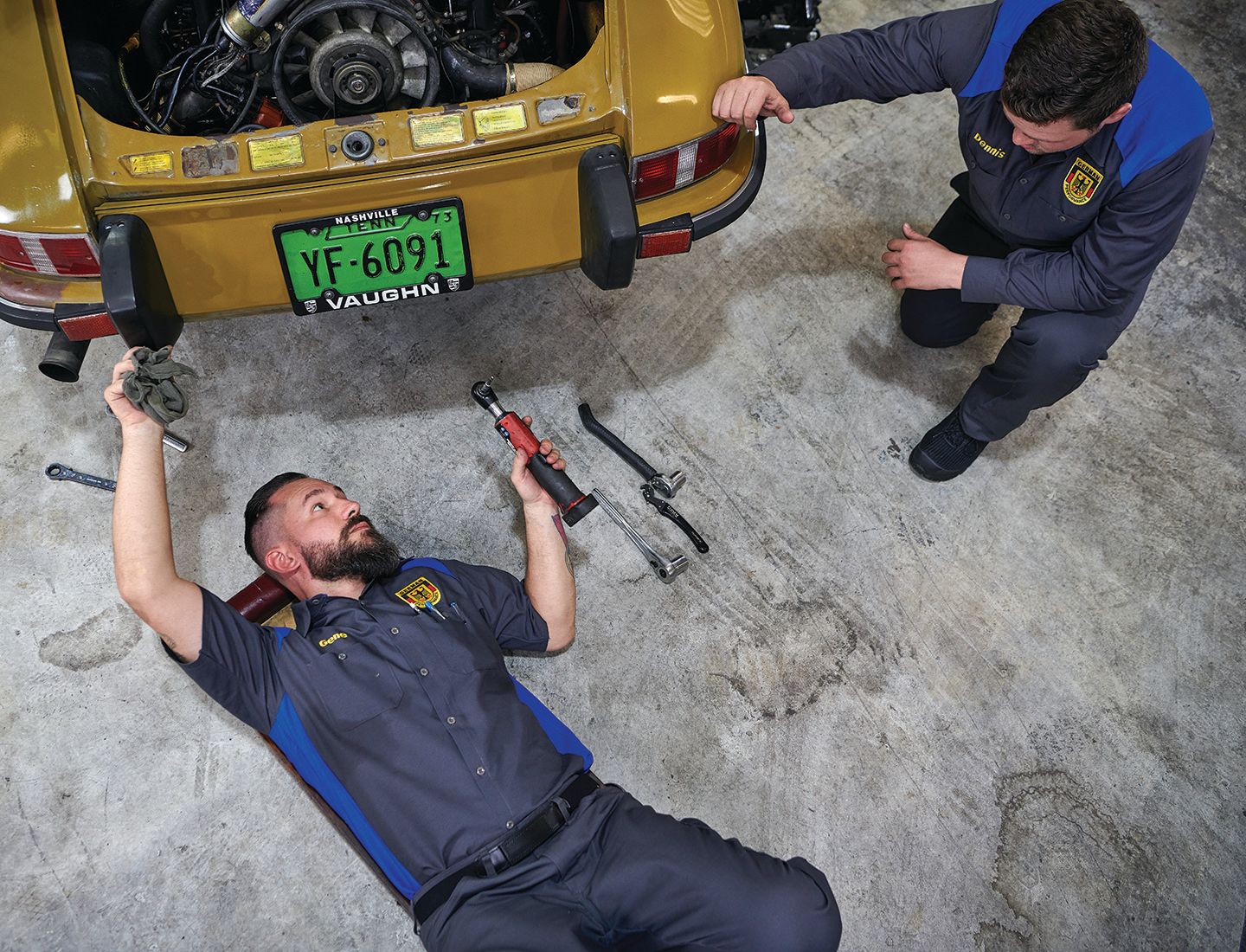 Mechanics working on a car