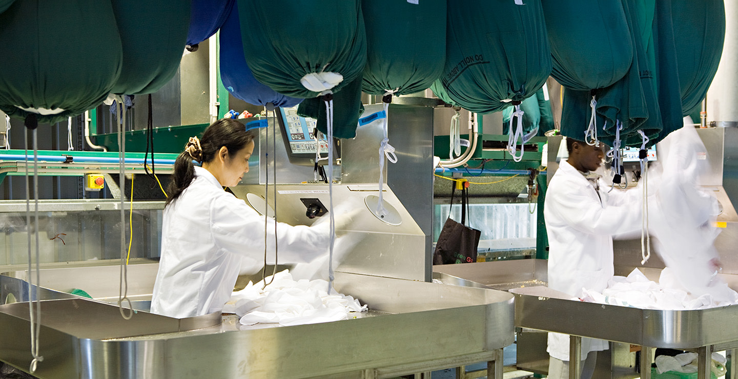 People cleaning industrial linen.