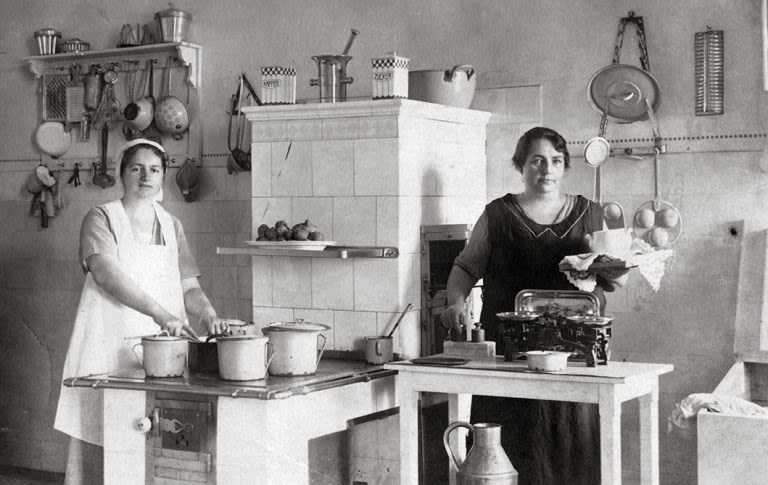 Vintage photo of two women wearing aprons