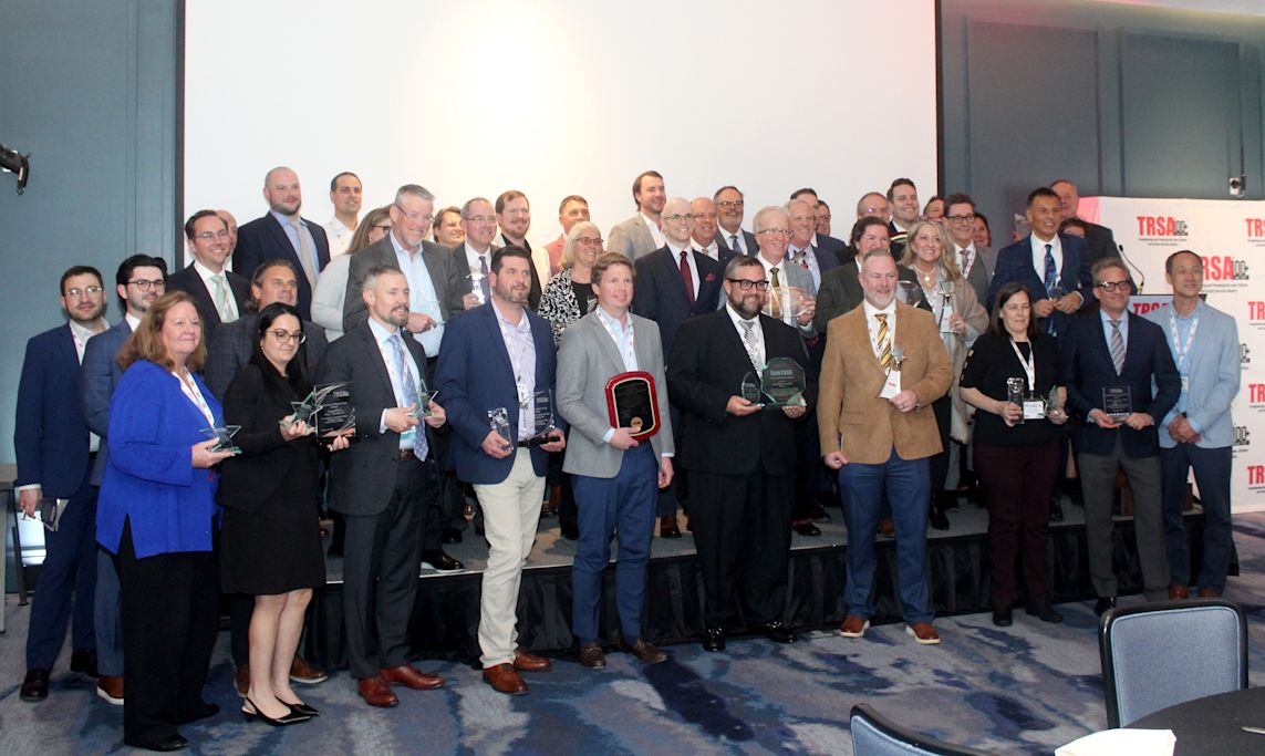 Recipients of 2026 TRSA Industry Awards gathered on a stage.