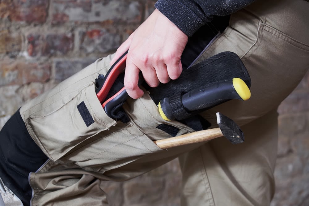 Cargo pants with tools in the pockets