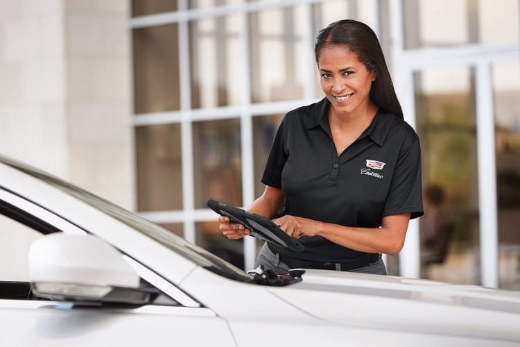 Woman working at an auto dealership