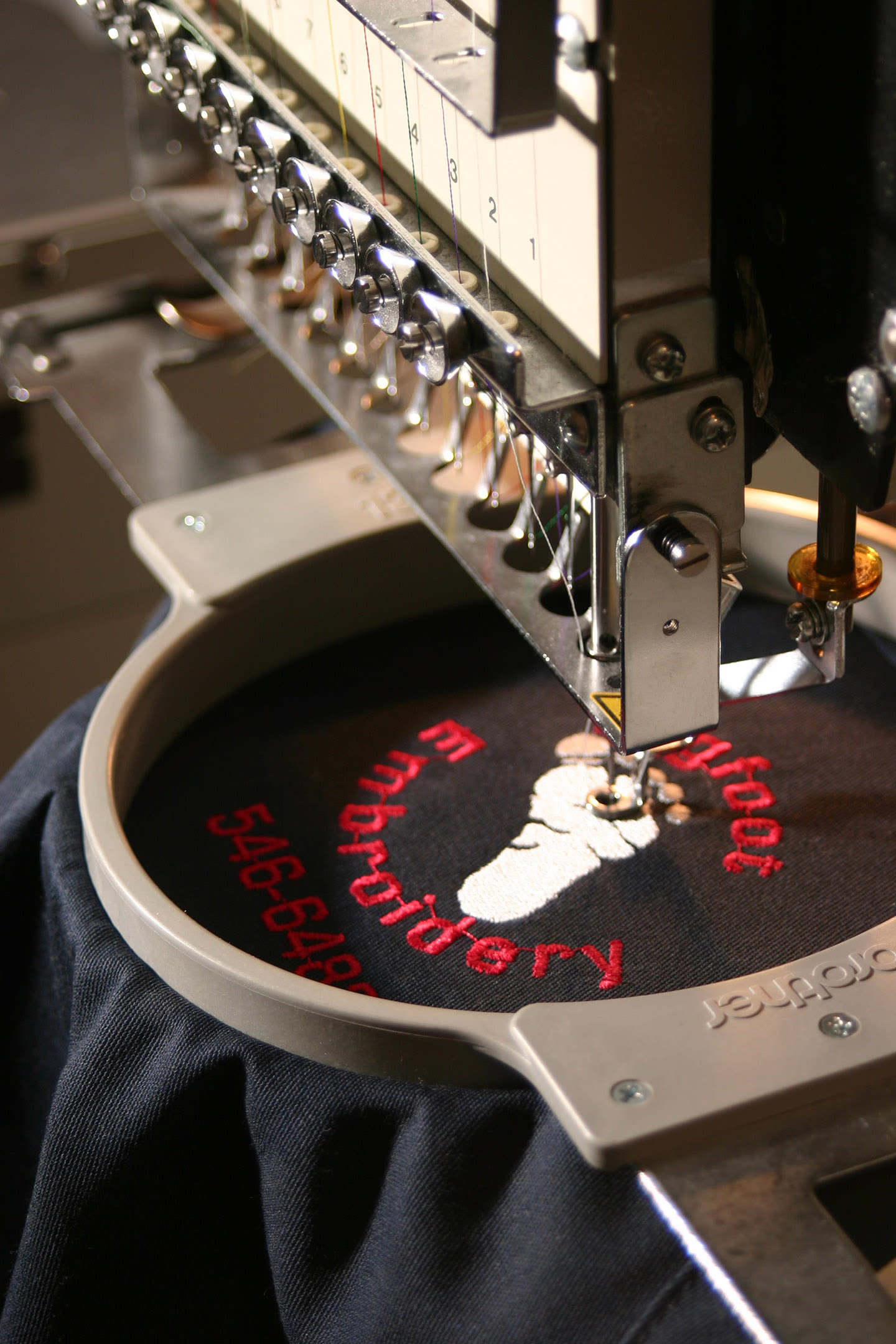 Uniform being embroidered.