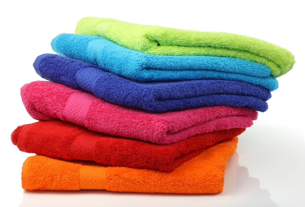 A rainbow-colored stack of plush bath towels