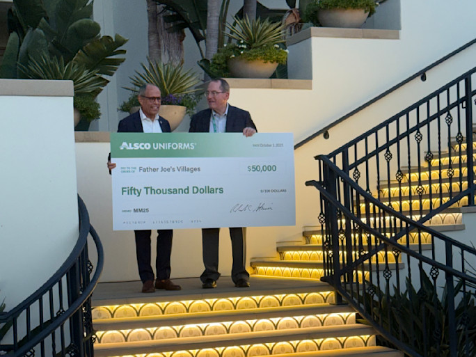 Alsco Uniforms CEO Bob Steiner delivering a $50,000 donation check to Father Joe's Villages CEO Jim Vargas