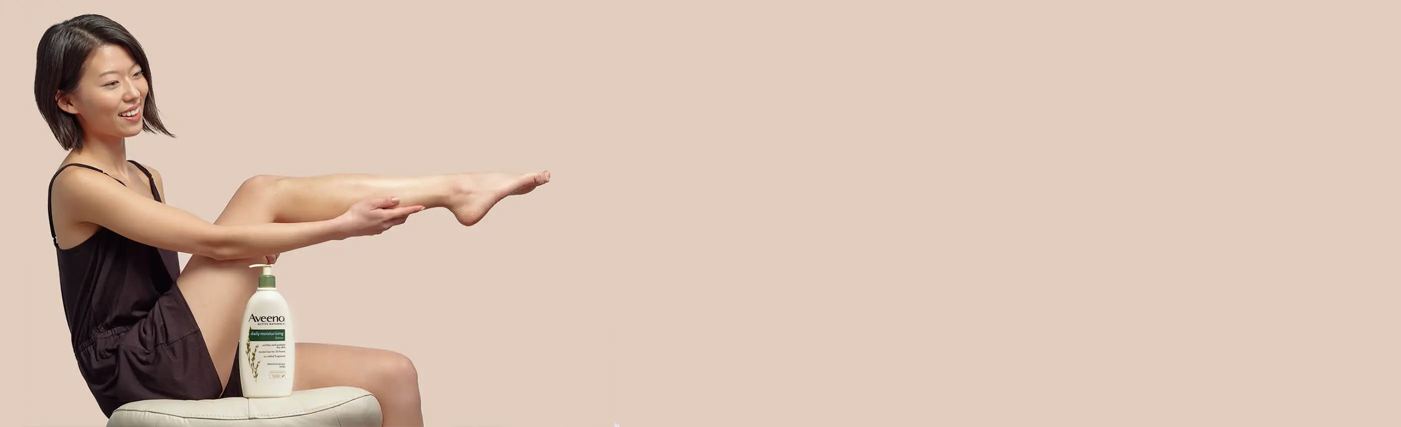 body-landing-talent-seated-holding-legs-looking-right-1.jpg