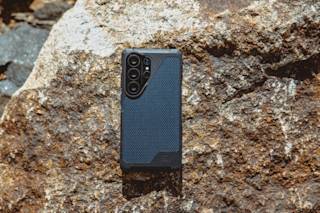 UAG Metropolis LT Galaxy S26 Ultra Case Galaxy S26 Ultra in Micro Hex Camo Graphite lifestyle view