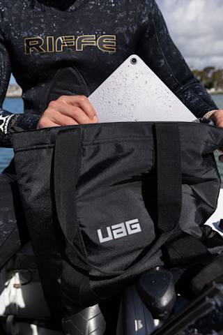 UAG Tech Tote with DRYOUT® Active Moisture-Removal Technology™ Backpacks case in Black lifestyle view