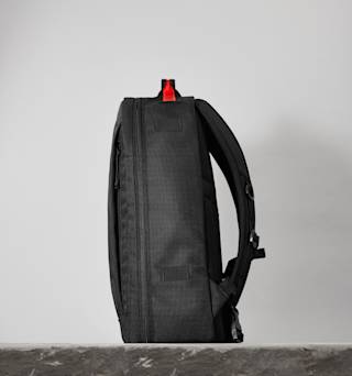 UAG The Brown Buffalo x UAG 21-Liter Back Pack Backpacks case in Black/Orange lifestyle view