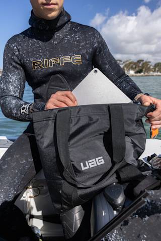 UAG Tech Tote with DRYOUT® Active Moisture-Removal Technology™ Backpacks case in Black lifestyle view