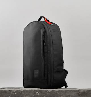 UAG The Brown Buffalo x UAG 21-Liter Back Pack Backpacks case in Black/Orange lifestyle view