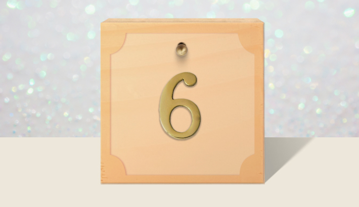 A closed brown gift box with #6