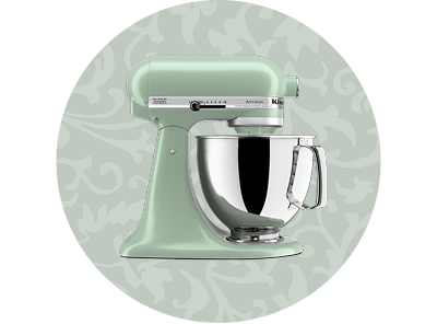 A Cardamom stand mixer on a patterned green background.