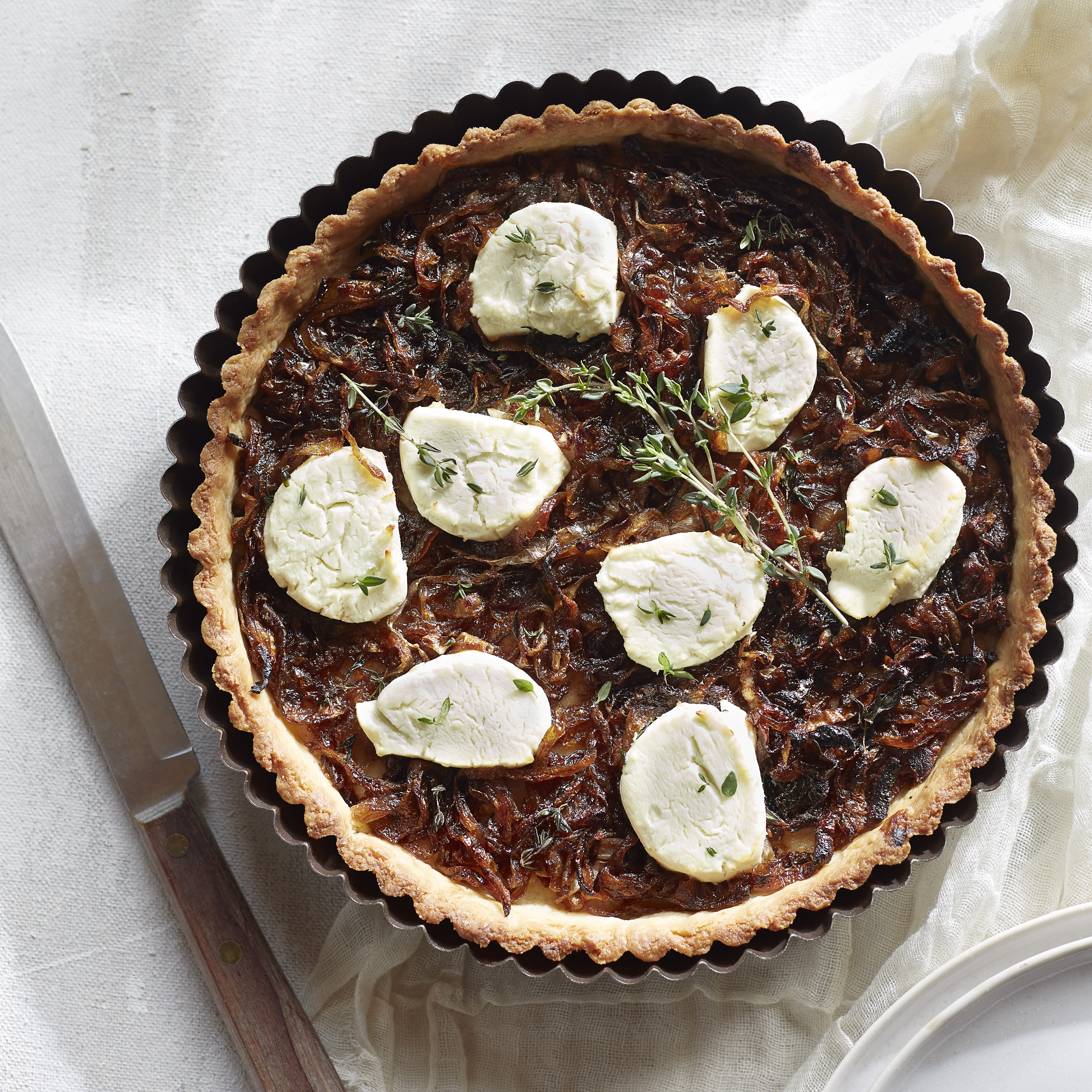 g0qHwivRPWLj3TNmODCO_Caramelized_Onio_and_Goat_Cheese_Tart_square.jpg