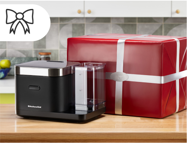 A KitchenAid® food chopper and red gift bag