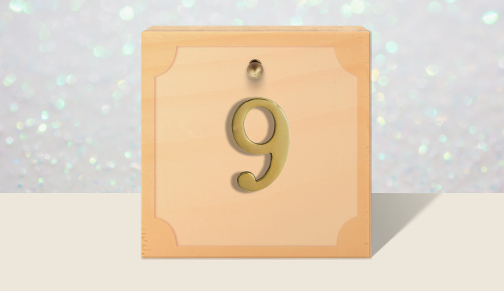 A closed brown gift box with #9