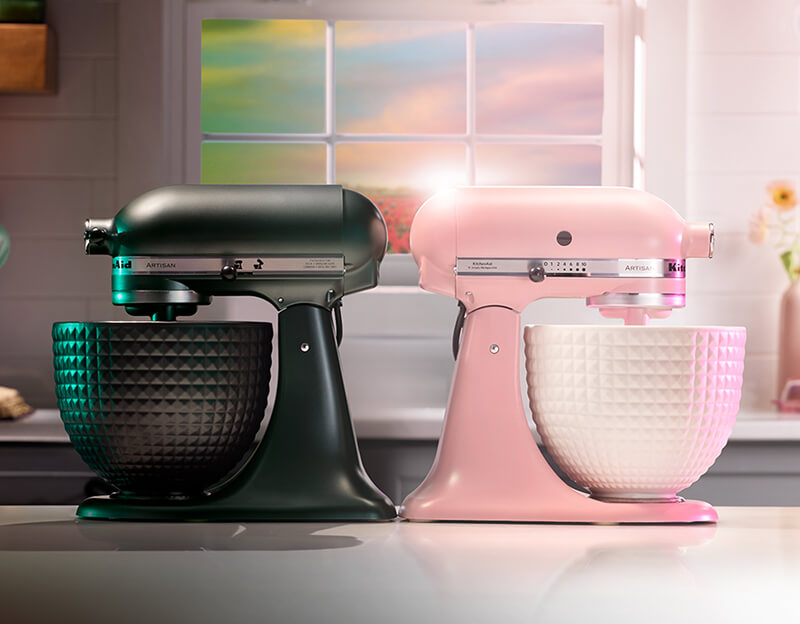 Two KitchenAid® stand mixers on a counter.