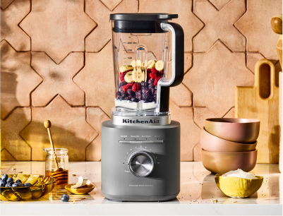 A silver KitchenAid® Pure Power blender with fruits inside
