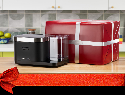 A KitchenAid® grain and rice maker and red gift box