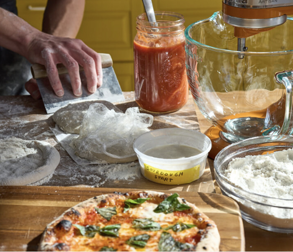 A person making pizza