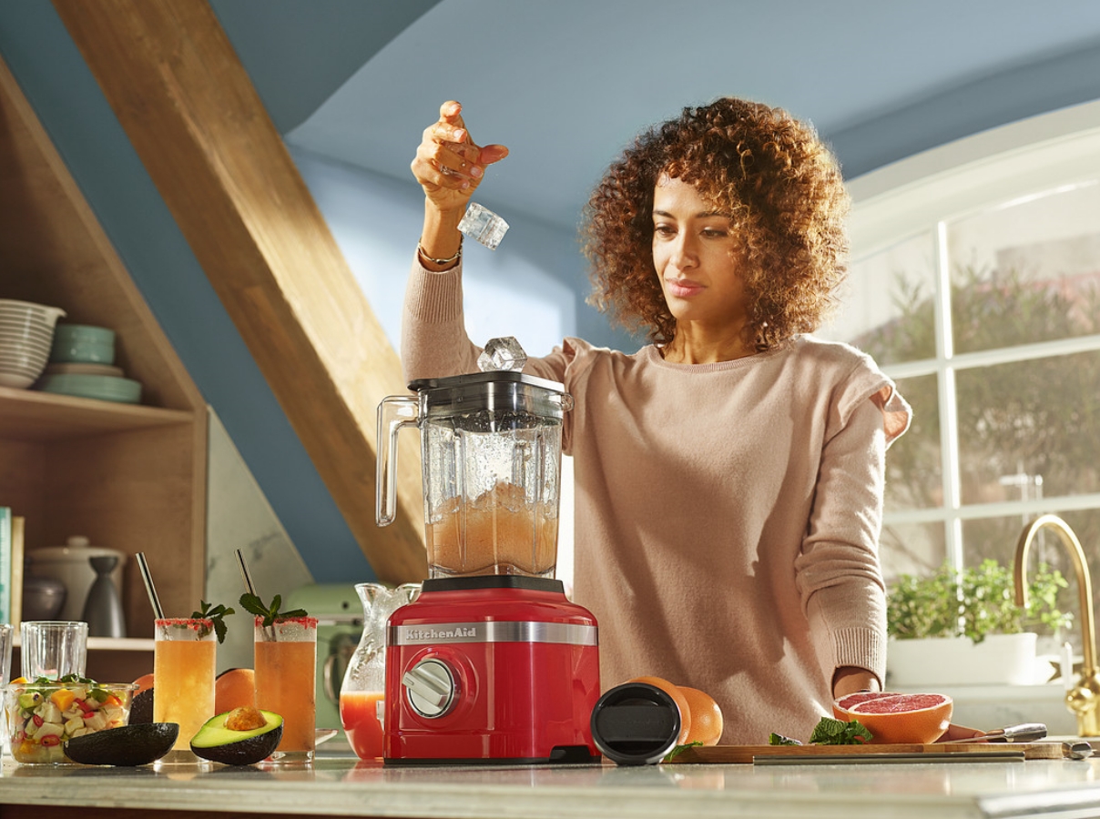 Red-blender-crushing-ice-and-preparing-a-cold-drink