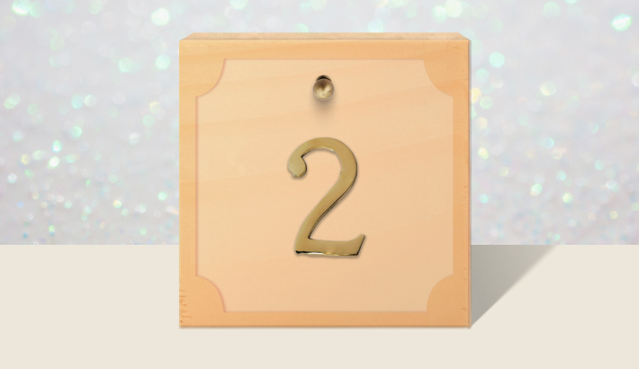 A closed brown gift box with #2