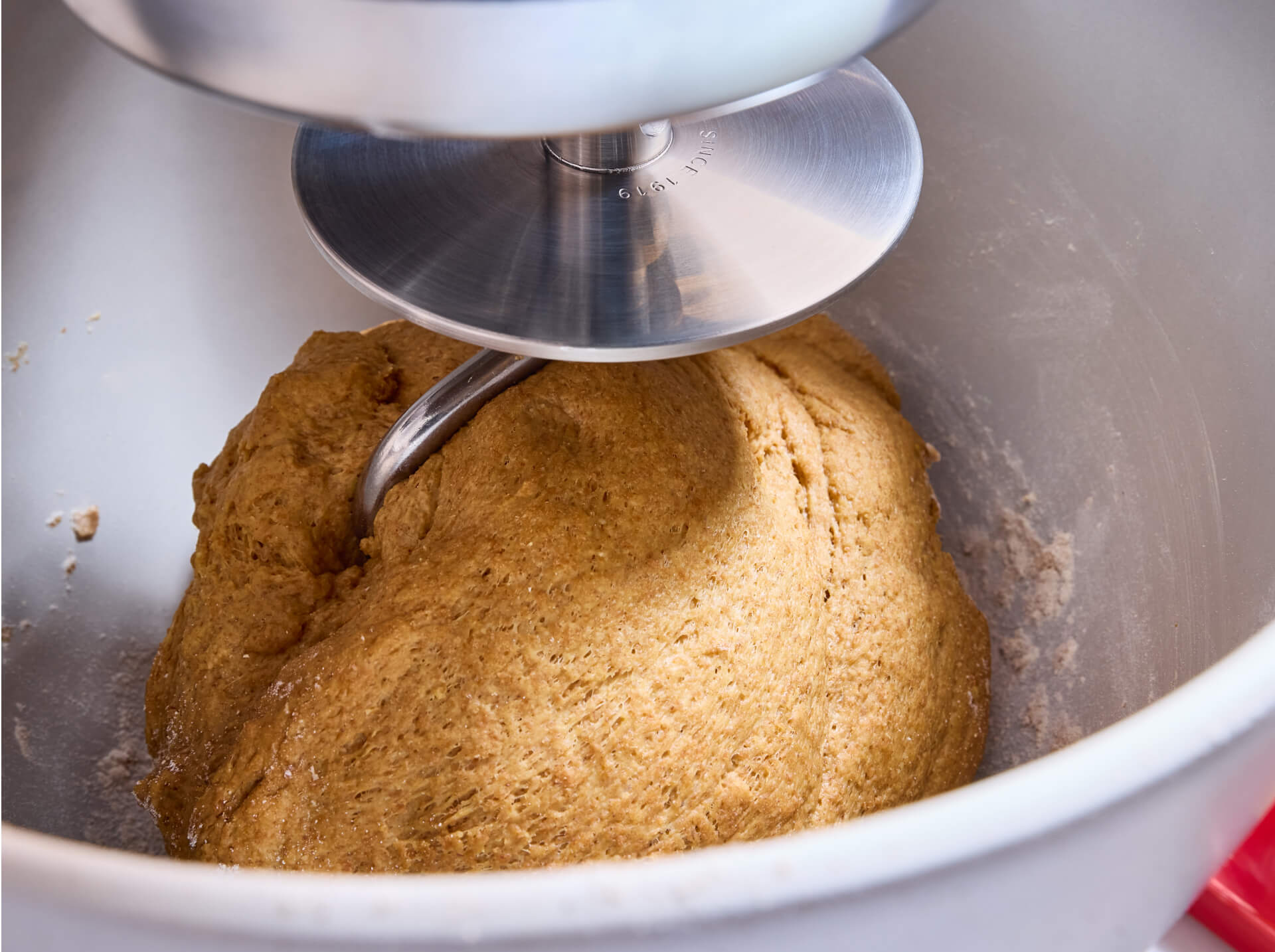 A KitchenAid<sup>®</sup> stand mixer with dough hook attachment