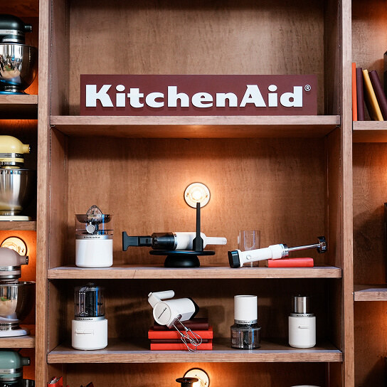 KitchenAid® cordless appliances in a cabinet