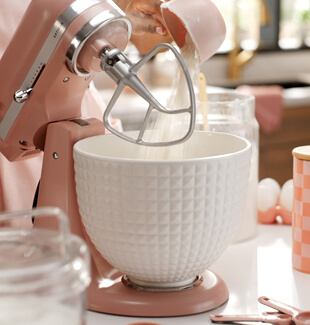 A pink KitchenAid® stand mixer and bowl