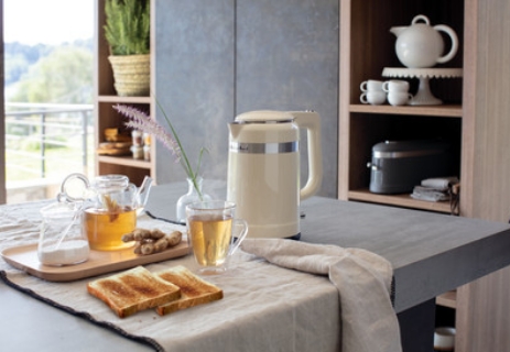 cream-kettle-with-tea-and-slice-of-bread