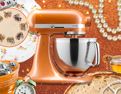 A KitchenAid® Stand Mixer in Tangerine Twinkle.