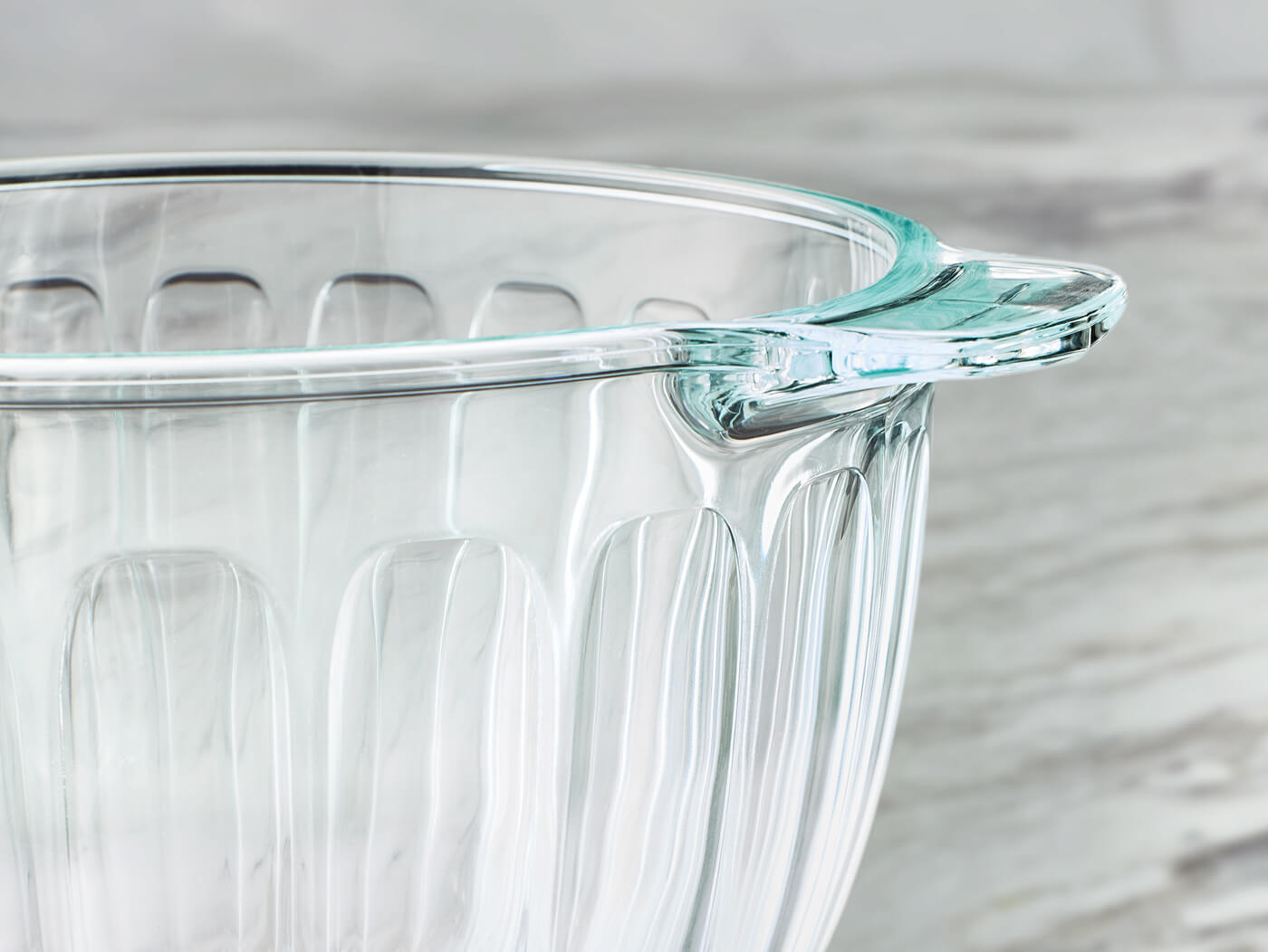 Close-up of the rim of a fluted glass mixer bowl