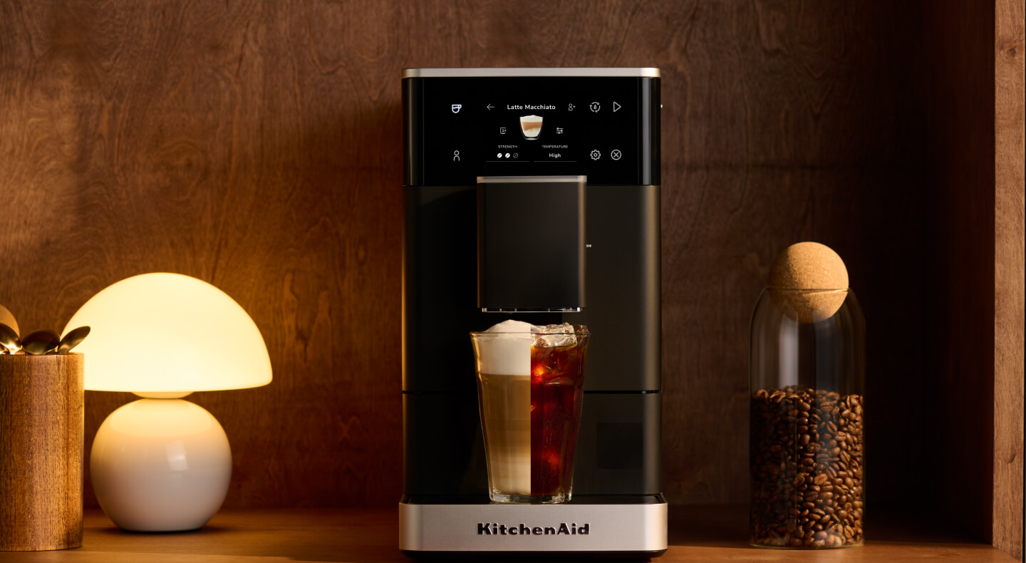 An espresso machine on a countertop with a drink