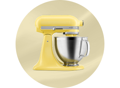 A Butter stand mixer on a patterned yellow background.
